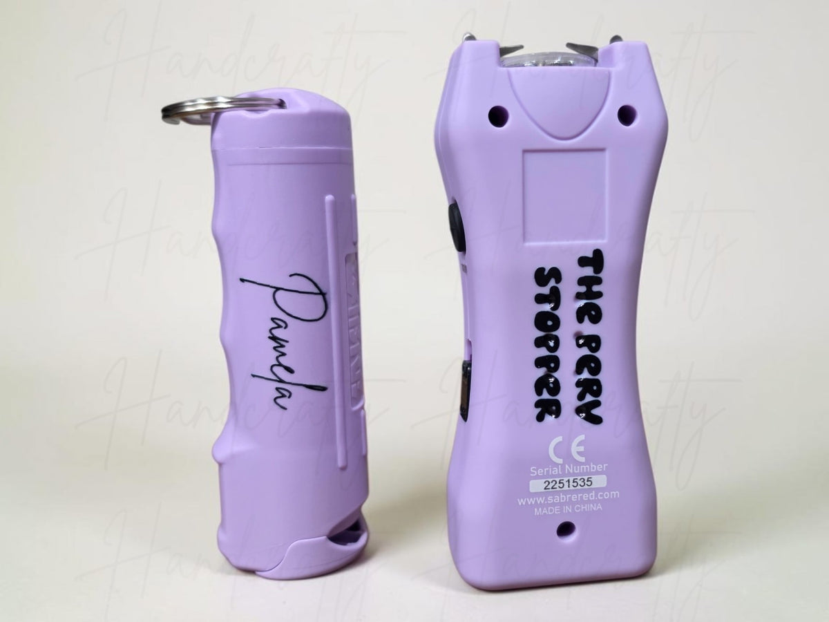 Personalized UV printed purple stun gun and pepper spray defense keychain set with custom name